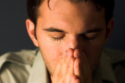 man crying praying